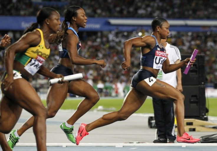 Jeter of the U.S. takes the baton from Myers on their way to winning the women&#039;s 4x100 metres relay final at the IAAF World Championships in Daegu