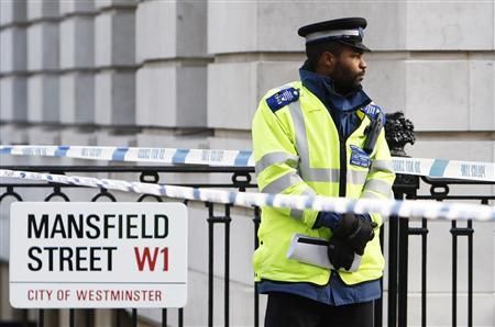  Go to ArticleA police support officer stands outside a mansion block, while police officers conduct a search in connection with an attack on a U.S. passenger jet, London December 27, 2009. 