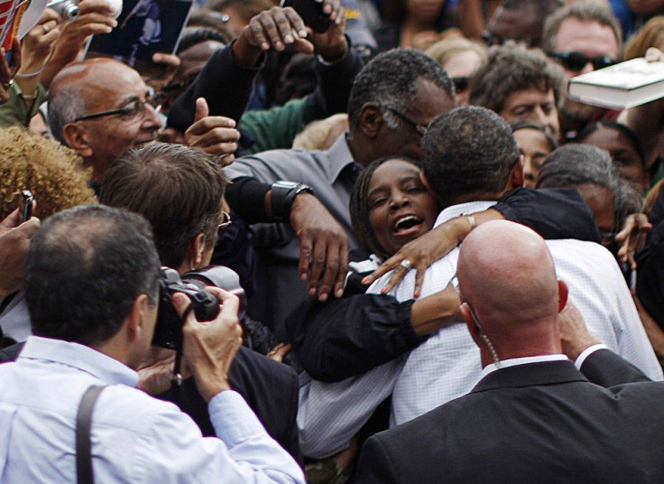A woman hugs U.S. President Obama at a Labor Day event in Detroit