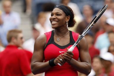 Serena Williams of the U.S. smiles after defeating Ana Ivanovic of Serbia in their match at the U.S. Open tennis tournament in New York
