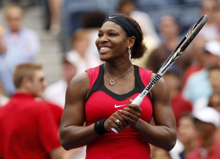 Serena Williams of the U.S. smiles after defeating Ana Ivanovic of Serbia in their match at the U.S. Open tennis tournament in New York