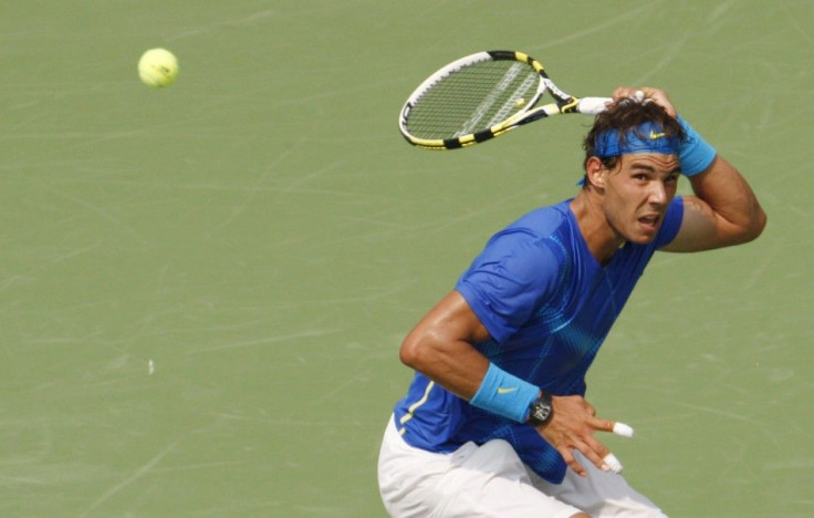 Rafael Nadal of Spain hits a return to David Nalbandian of Argentina during their match at the U.S. Open tennis tournament in New York