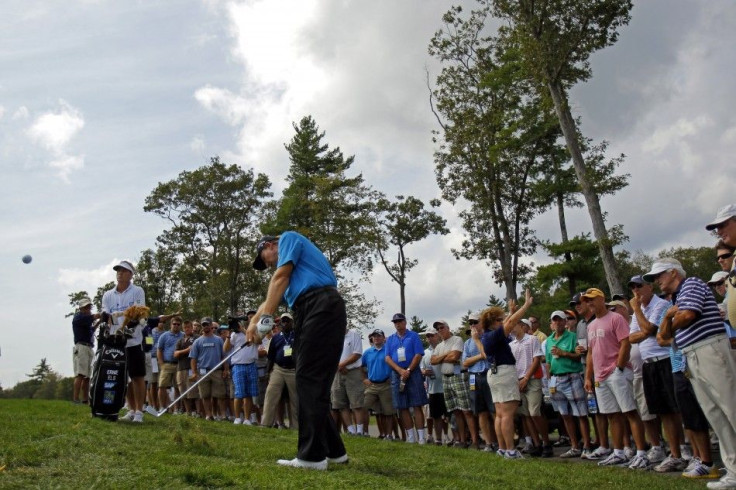 Ernie Els of South Africa hits out of the rough on the side of the 2nd fairway during the final round of the Deutsche Bank Championship golf tournament in Norton