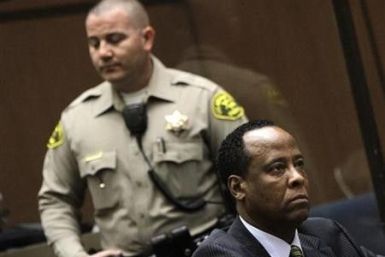Doctor Conrad Murray, the late Michael Jackson&#039;s personal physician, listens during his arraignment on a charge of involuntary manslaughter in the pop star&#039;s death, in Los Angeles