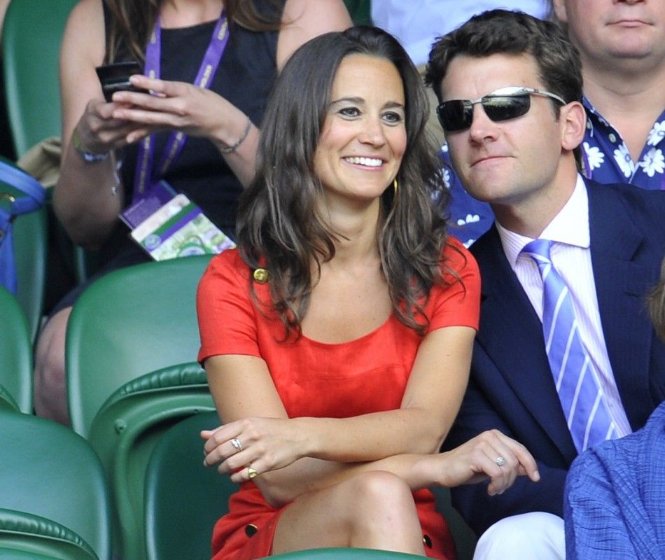  The sister of Catherine, Duchess of Cambridge, Pippa Middleton and former English cricketer, Alex Loudon, sit on Centre Court at the Wimbledon tennis championships in London