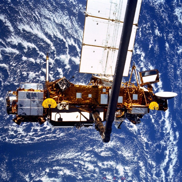 The seven-ton Upper Atmosphere Research Satellite (UARS) is deployed by the Space Shuttle Discovery (STS-48) in this NASA handout photo dated September 1991. NASA is expecting the satellite to re-enter Earth's atmosphere in late September or early October