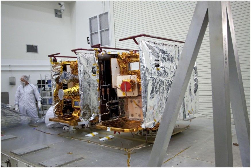 NASAs GRAIL twin spacecraft stand side by side as they are prepared for testing and processing in the Astrotech payload processing facility in Titusville