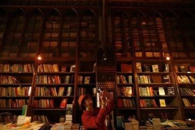 A woman takes a picture in a bookstore in this file photo.