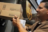 UPS driver T.J. Dellasala delivers two packages from Amazon.com in Boston, Massachusetts