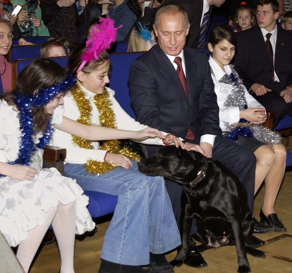 Russian girls pet President Putin039s dog Conny during New Year show at State Kremlin Palace in Moscow.