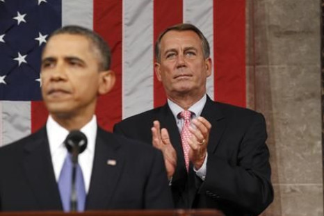 Speaker of the House John Boehner applauds as President Barack Obama addresses a joint session of Congress about jobs creation.