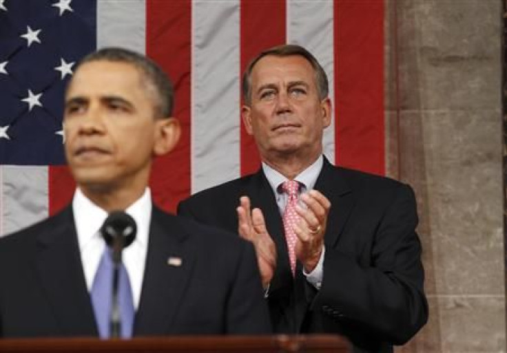 Speaker of the House John Boehner applauds as President Barack Obama addresses a joint session of Congress about jobs creation.