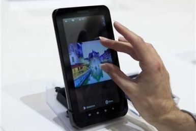 Man uses touch screen of Samsung&#039;s Galaxy Tab tablet device at IFA consumer electronics fair in Berlin
