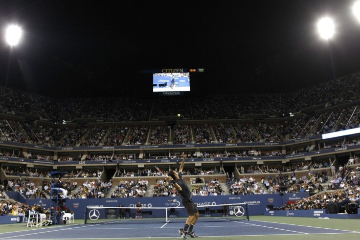Federer serves to Tsonga during their quarterfinal match at the U.S. Open tennis tournament in New York