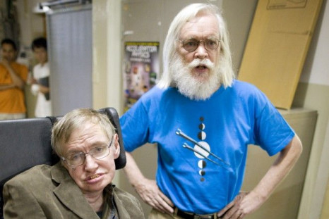 Theoretical physicists Stephen Hawking (L) and John Ellis.