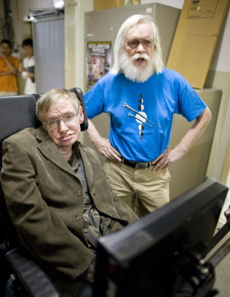 Theoretical physicists Stephen Hawking (L) and John Ellis.