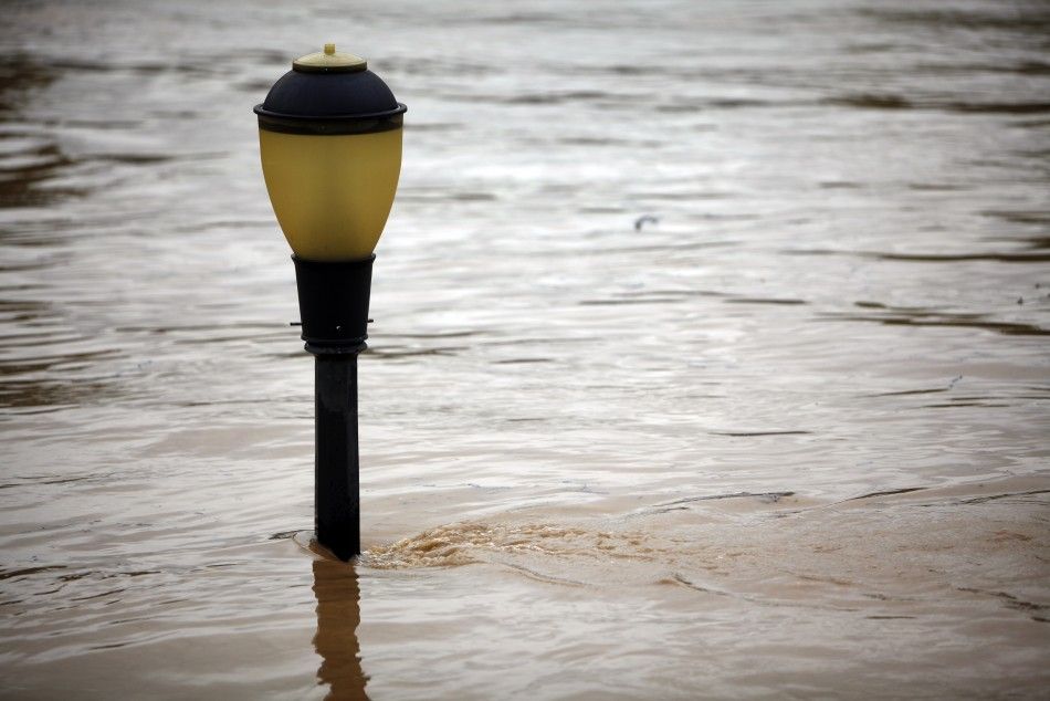 A streetlight is submerged by floodwaters from Susquehanna River in Kingston