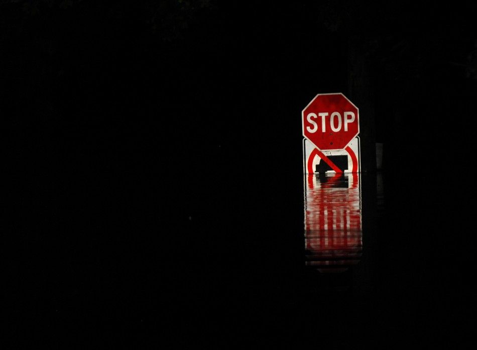A street sign is submerged in floodwaters from the Susquehanna River in West Pittston