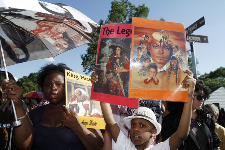 Fans attend a tribute ceremony outside Michael Jackson's boyhood home in Gary