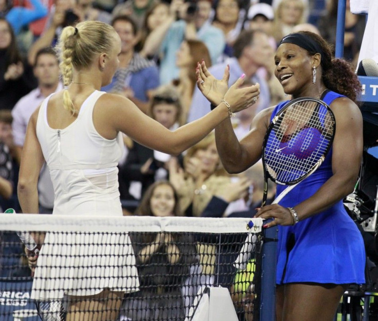 Serena Williams of the U.S. shakes hands at the net with Caroline Wozniacki of Denmark after winning their semi-final match at the U.S. Open tennis tournament in New York