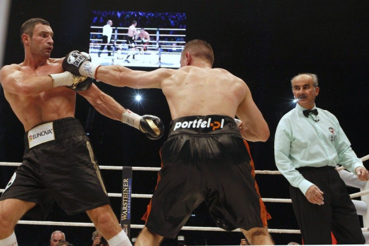 Klitschko exchanges punches with Adamek during their WBC Heavyweight Championship title fight in Wroclaw
