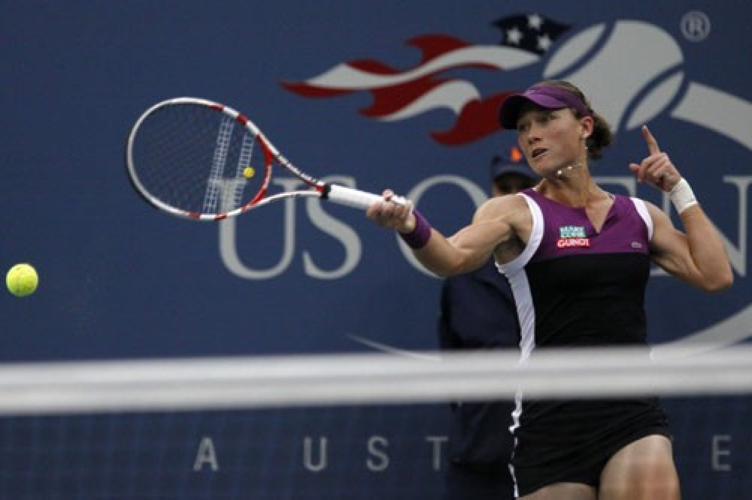 Samantha Stosur AUS with a big return against Serena Williams USA
