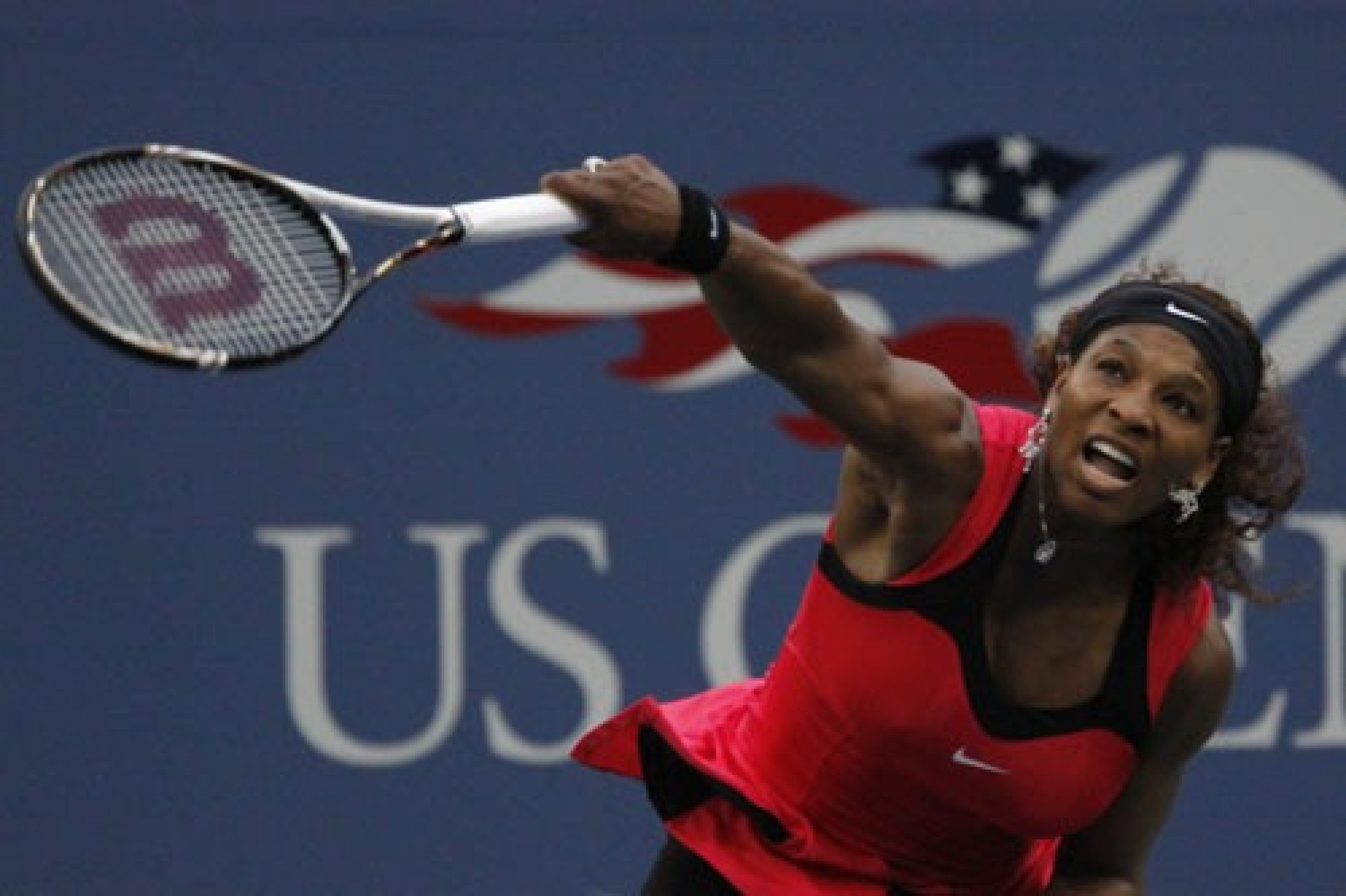 Serena Williams USA serving to Samantha Stosur AUS