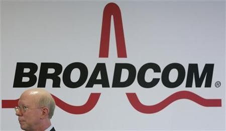 Broadcom Corporation President and Chief Executive Officer Scott McGregor stands in front of the company's logo in Taipei March 18, 2010.