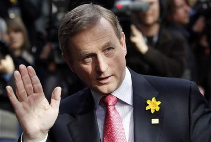 Irish Prime Minister Enda Kenny waves as he arrives at an European Union leaders summit in Brussels in this March 25, 2011 file photograph.