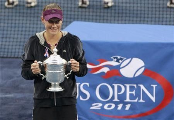 Samantha Stosur of Australia poses with her trophy during the presentation ceremony after defeating Serena Williams of the U.S. to win the final of the U.S. Open tennis tournament in New York