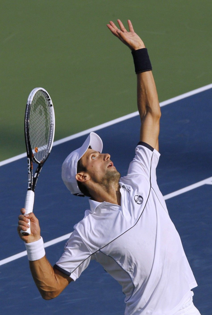 Novak Djokovic of Serbia serves to Rafael Nadal of Spain during the men&#039;s final of the U.S. Open tennis tournament in New York
