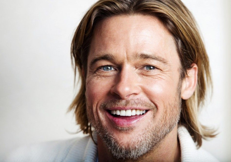 Actor Pitt of the film &quot;Moneyball&quot; poses during the 36th Toronto International Film Festival