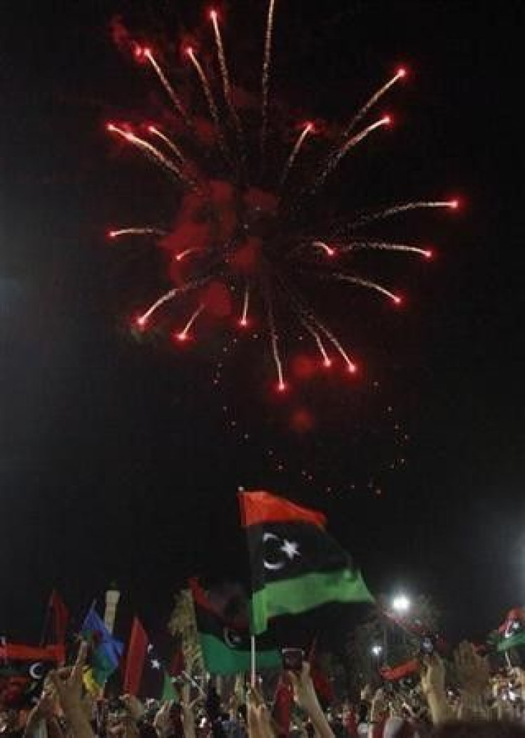 Fireworks explode during the arrival of National Transitional Council (NTC)