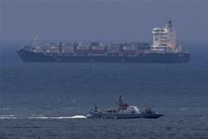 An Israeli naval vessel (front) patrols near the port of Ashdod