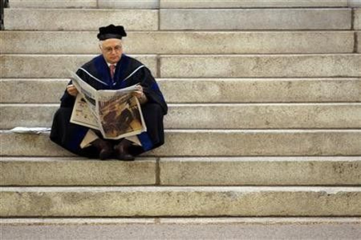 Thomas Michel, a professor at Harvard Medical School, waits for the start of the 360th Commencement Exercises at Harvard University in Cambridge, Massachusetts