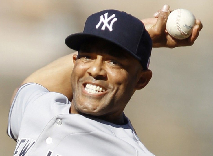 New York Yankees closing pitcher Mariano Rivera delivers on his way to recording his 599th career save against the Los Angeles Angels during the ninth inning of an MLB American League baseball game in Anaheim, California September 11, 2011.