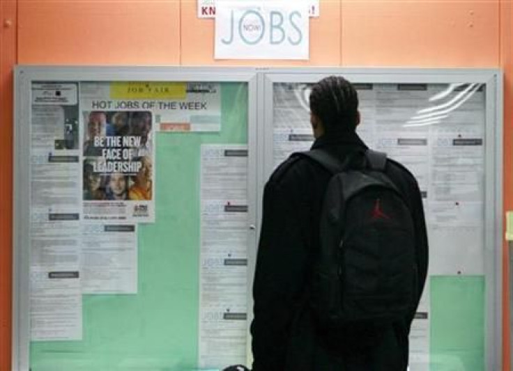 File photo of a man looking at employment opportunities at a jobs center in San Francisco