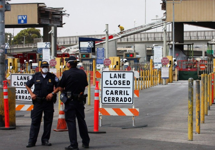 Border police stand near the collapsed scaffolding supporting the roof at the San Ysidro port of entry, linking Tijuana, Mexico, with San Diego, California, in Tijuana