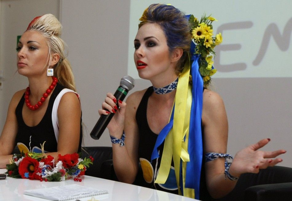 An Ukrainian activist from womens rights organisation Femen speaks to the media after their performance in Warsaw 