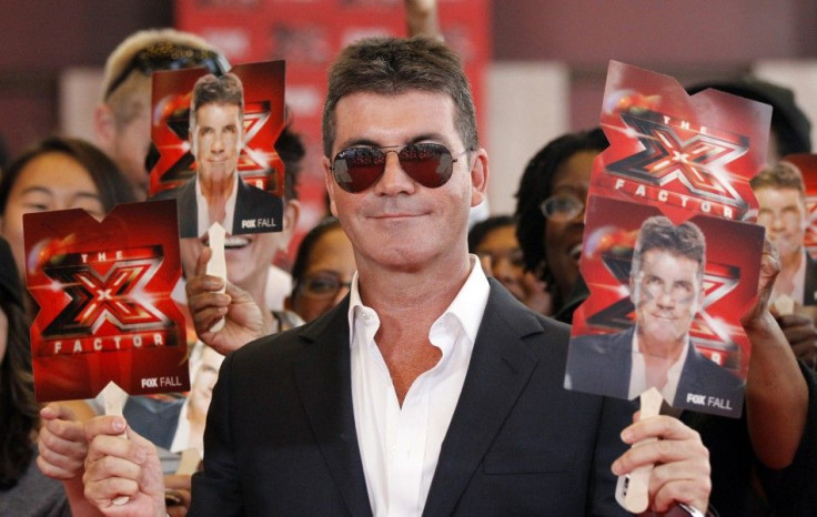 Simon Cowell poses at the world premiere of &quot;The X Factor&quot; in Hollywood
