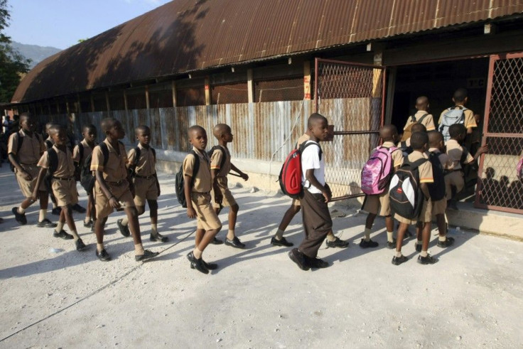Students walk into Kindergarten Frere Polycarpe du Sacre-Coeur in downtown Port-au-Prince