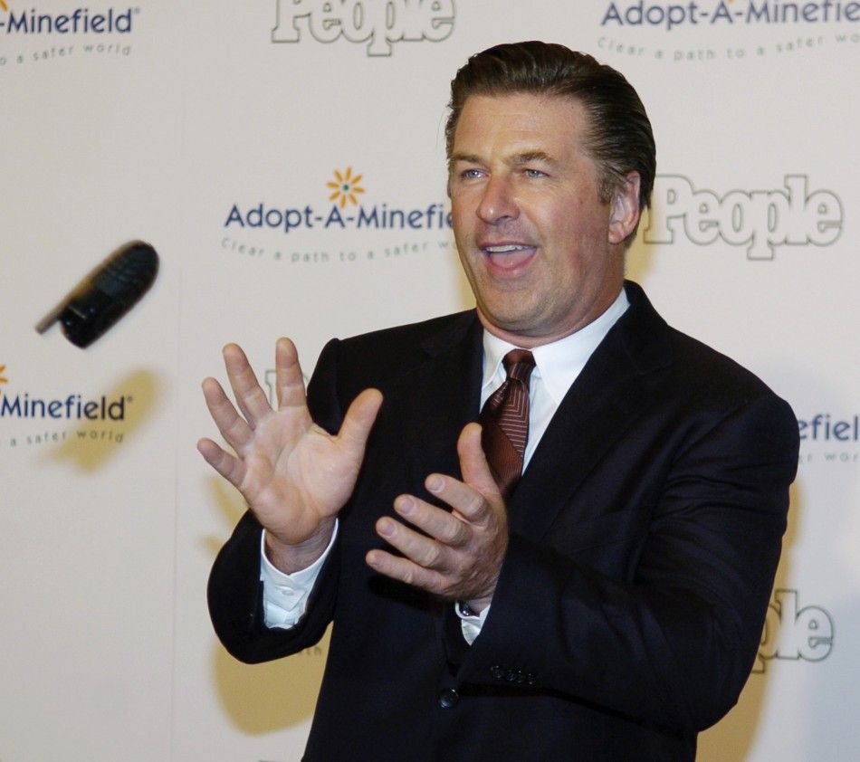 Actor Alec Baldwin catches a cellphone as he arrives for 5th Annual Adopt-A-Minefield Gala in Beverly Hills