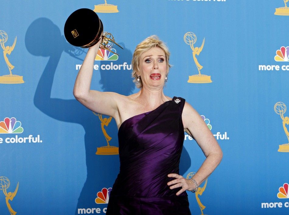 Jane Lynch, winner for outstanding supporting actress in a comedy series, poses with her award backstage at the 62nd annual Primetime Emmy Awards in Los Angeles