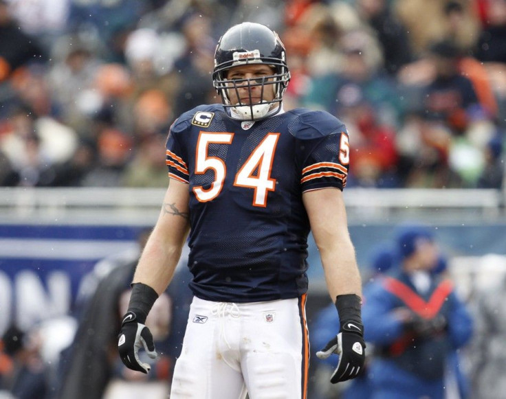 Bears' Urlacher pauses during a break in play between the Bears and the Seahawks in their NFC Divisional NFL playoff football game in Chicago