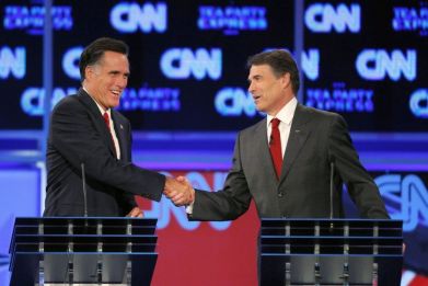 Romney (L) and Texas Governor Rick Perry shake hands at the conclusion of the CNN/Tea Party Republican presidential candidates debate in Tampa