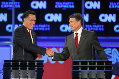 Romney (L) and Texas Governor Rick Perry shake hands at the conclusion of the CNN/Tea Party Republican presidential candidates debate in Tampa