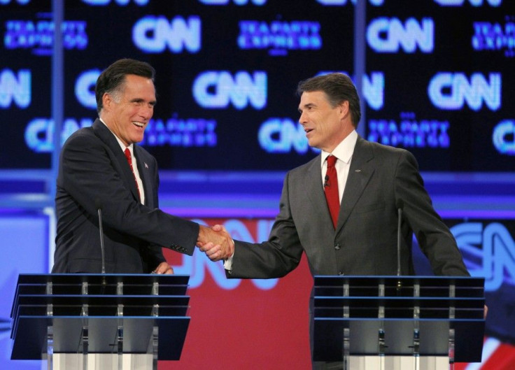 Romney (L) and Texas Governor Rick Perry shake hands at the conclusion of the CNN/Tea Party Republican presidential candidates debate in Tampa