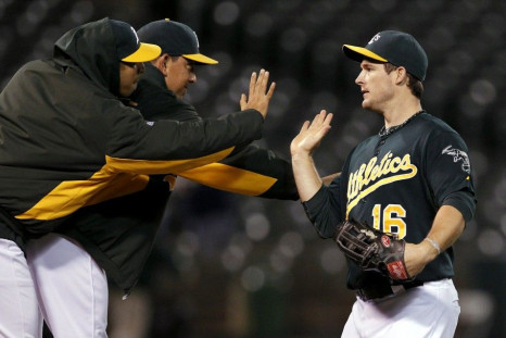 Athletics&#039; Willingham celebrates after winning their MLB American League baseball game against the Tigers in Oakland
