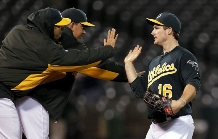 Athletics&#039; Willingham celebrates after winning their MLB American League baseball game against the Tigers in Oakland