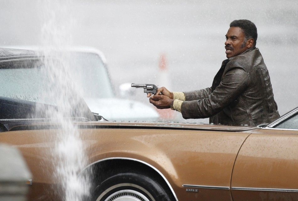 Actor Keith David holds a gun during filming of quotCloud Atlasquot in Glasgow, Scotland 